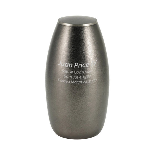 Close-up of the textured slate-finish brass cremation urn showing lid and surface finish