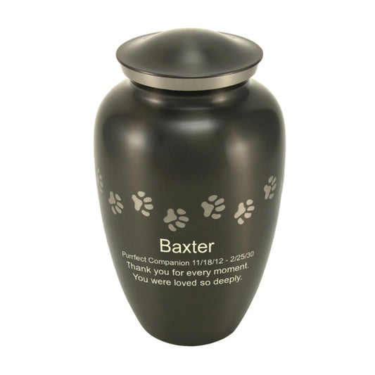 Slate-finish brass cremation urn with paw print accents front view on white background