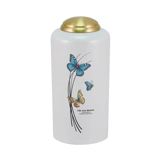 Pearlized brass cremation urn with butterfly artwork front view on white background