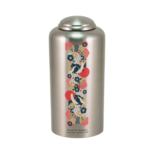 Pewter-finish brass cremation urn with crane birds front view on white background