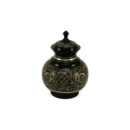 Metal urn featuring a striking black and gold finish with intricate engraved floral and geometric patterns