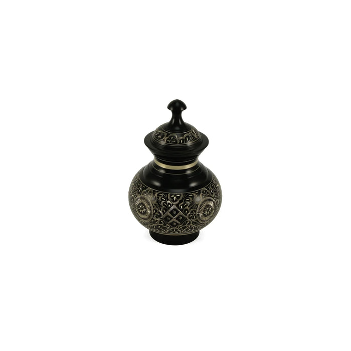 Inlaid metal pot featuring a lustrous black finish adorned with intricate silver floral and geometric patterns, a distinct silver band, and a decorative finial on its domed lid