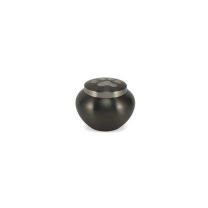 Dark grey bulbous metal pet urn with a silver accent ring and a prominent paw print on the lid