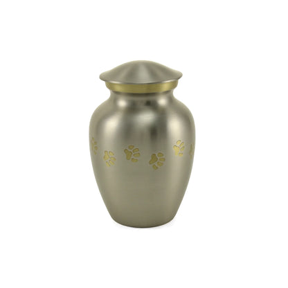 Brushed silver pet urn with a gold band at the neck and scattered gold paw print engravings