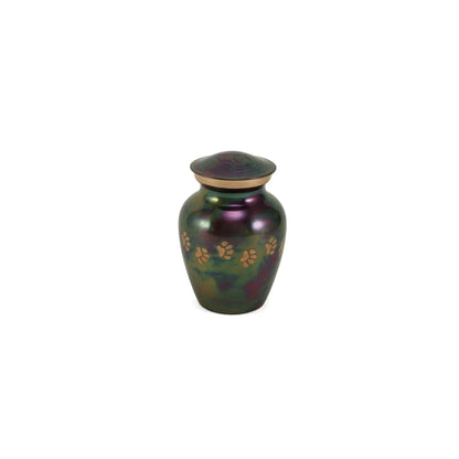 A metallic pet urn featuring an iridescent green and purple finish, adorned with gold paw print designs and a subtle gold accent band on the neck