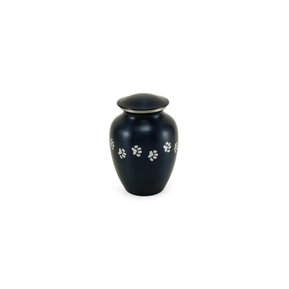 Metal pet cremation urn with a dark blue-black metallic finish, adorned with a silver paw print motif and a domed lid featuring a silver band
