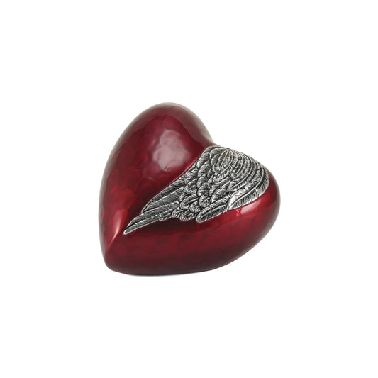 Aluminum heart-shaped cremation urn with heart and wing design front view on white background