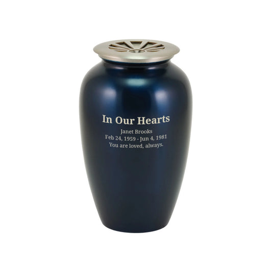 Midnight blue-finish brass tall cylindrical scattering urn with sunray pattern upright on white background