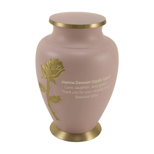 Brass cremation urn with rose design front view on white background