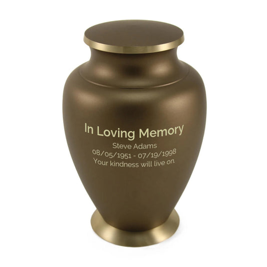 Brass cremation urn with wheat stalk design front view on white background