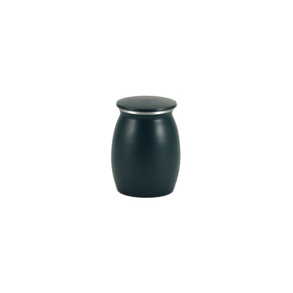 Modern dark blue-green matte finish cremation urn with a sleek barrel shape and a subtle silver band below its flat lid on a white studio background