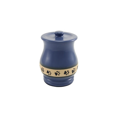 Ceramic lidded pet treat jar with a glossy navy blue finish and a beige band decorated with black paw prints