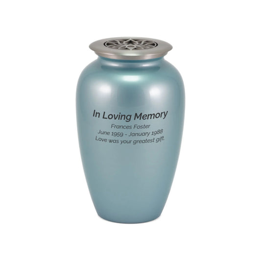 Blue frost-finish brass tall cylindrical scattering urn with lotus motif upright on white background