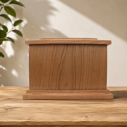 Rear view of cherry wood memorial box with removable storage panel and screws