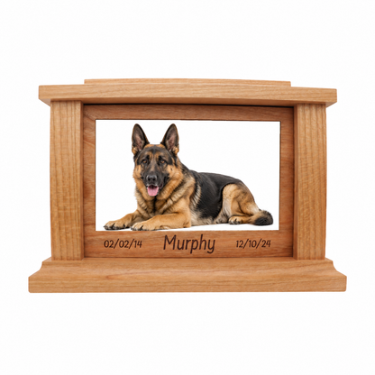 Wooden pet urn with a photo of a German Shepherd and engraved details on a white background