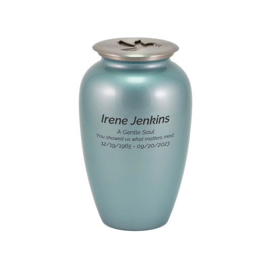 Blue frost-finish brass tall cylindrical scattering urn with dove artwork upright on white background